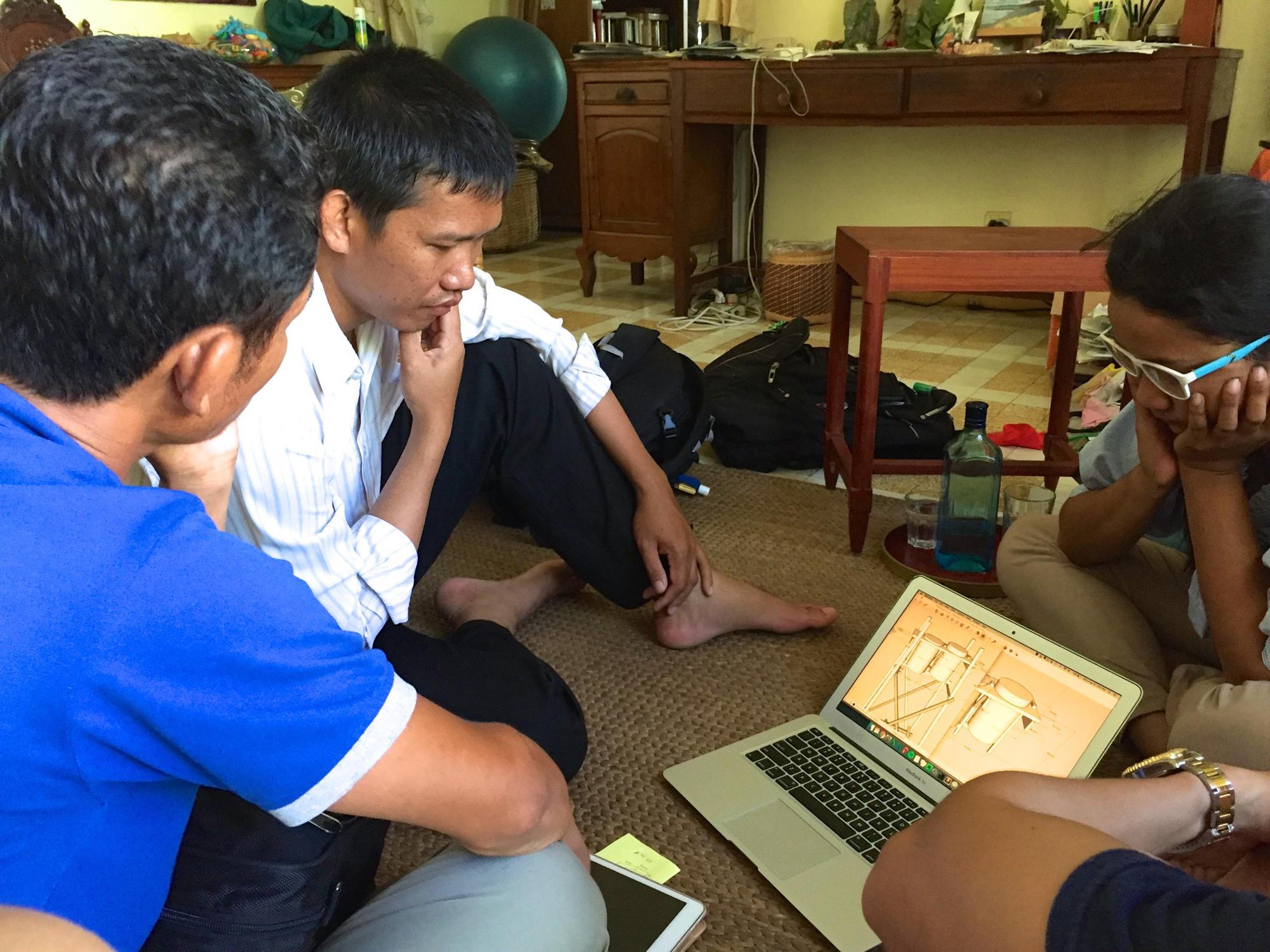 engineers looking at a computer