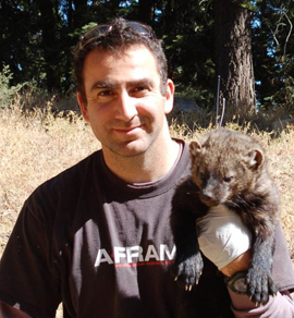 Mourad Gabriel with a fisher on his shoulder