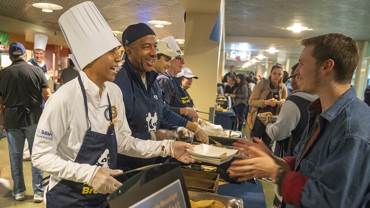 LeShelle May and Chancellor May serve Moonlight Breakfast, December 2018.