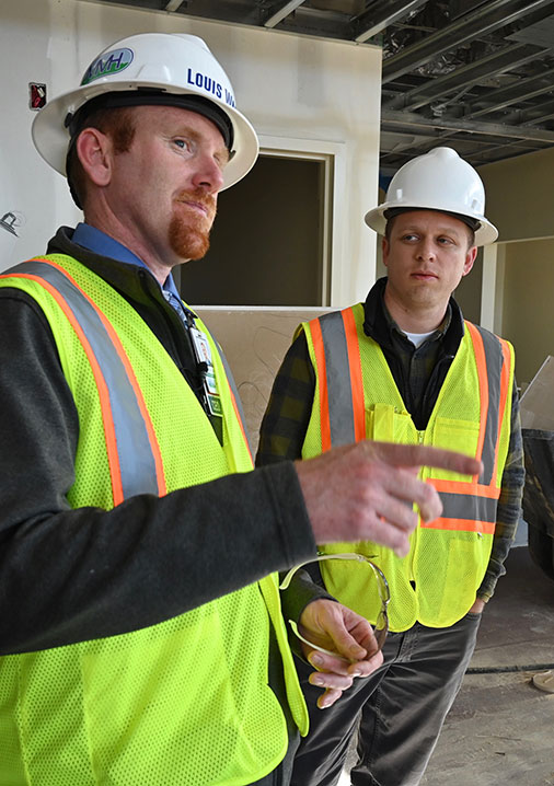 Louis Ward, left, CEO of Mayers Memorial Hospital District, and Saborido look over the construction of the hospital's new outpatient clinic for primary care medicine.