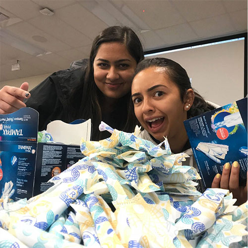 Sabina Kabra '20 and Anusha Klinder '20 pack period products to send to shelters