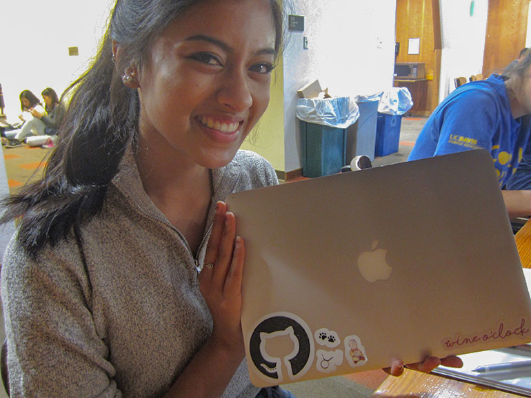 Ruthi Sankarram holds her laptop