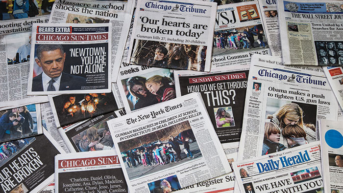 Local and national newspapers after the 2012 shooting in Newtown, Connecticut