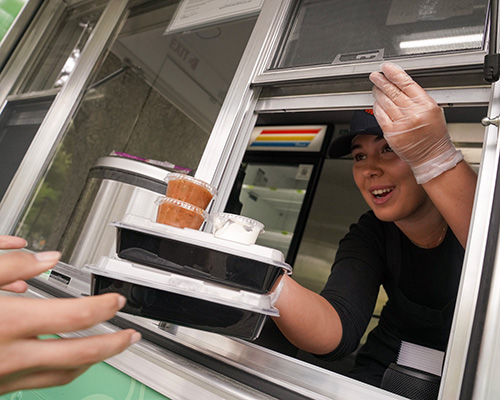 Second-year food science major Bianca Tomat calls out orders from the AggieEats food truck. (Karin Higgins/UC Davis)