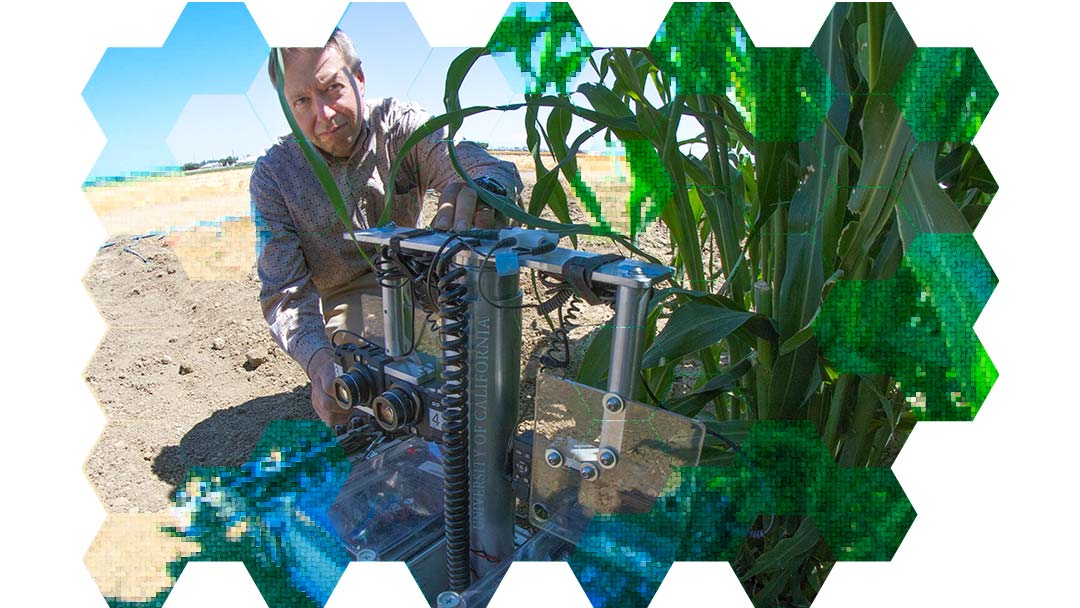 Professor David Slaughter with a machine in a farm field