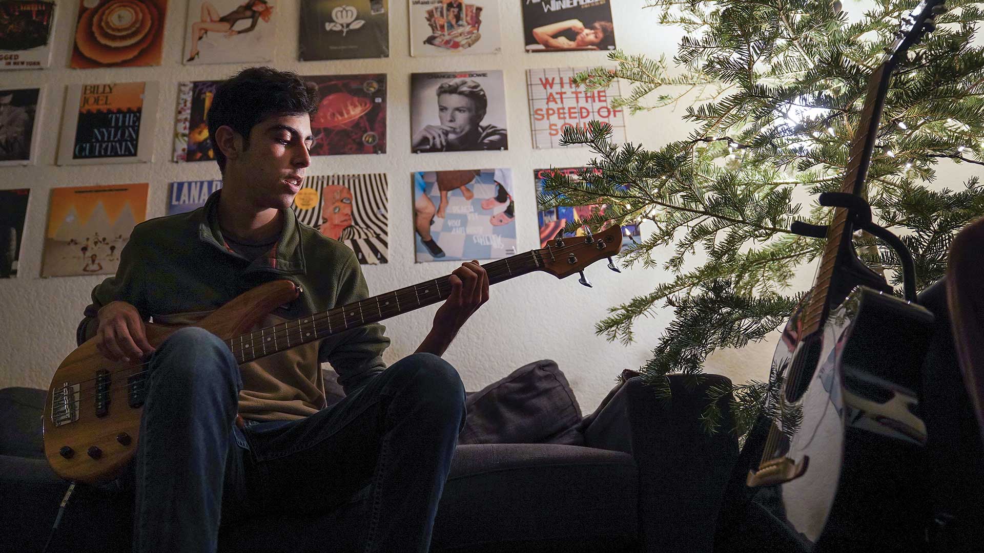 a student plays the guitar