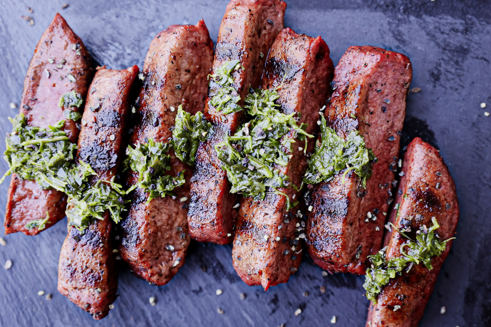 The Better Meat Co. makes a steak from Rhiza mycoprotein, a protein made from a fungus. Their steak is shown here cut in slices and covered with chimichurri sauce. UC Davis researchers are looking for ways to bring alternative proteins to market on a large scale. (Courtesy / Better Meat Co.)