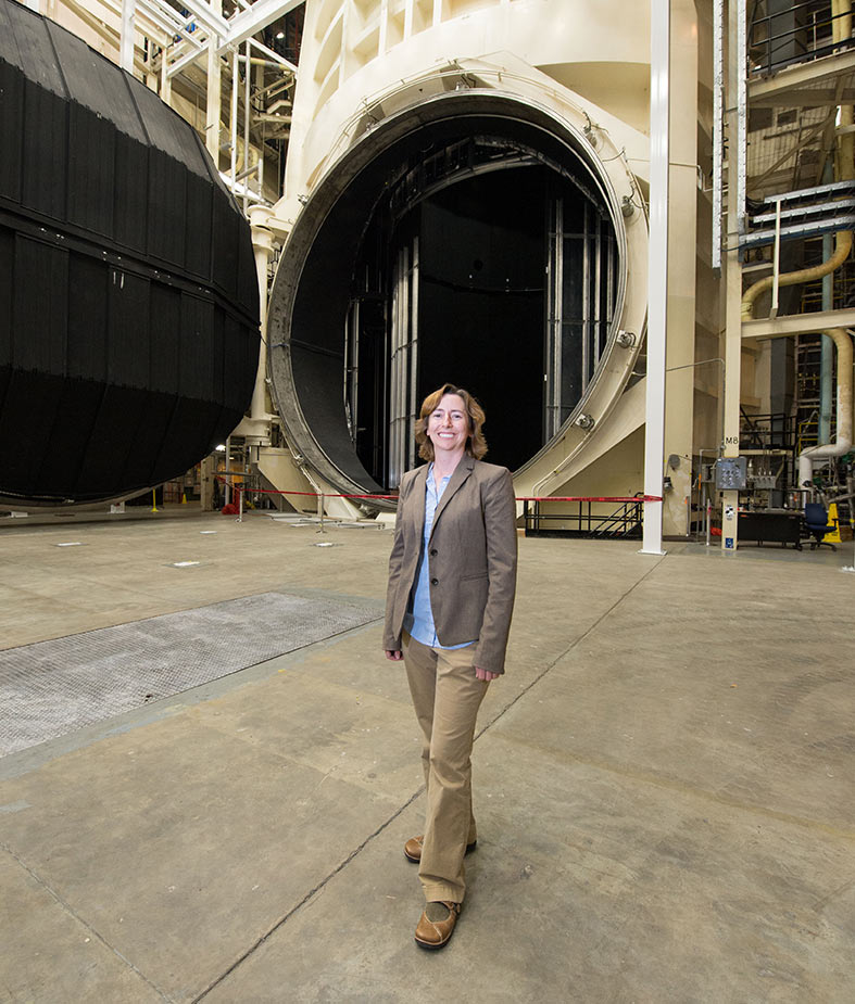 liz-warren-in-front-of-vacuum-chamber