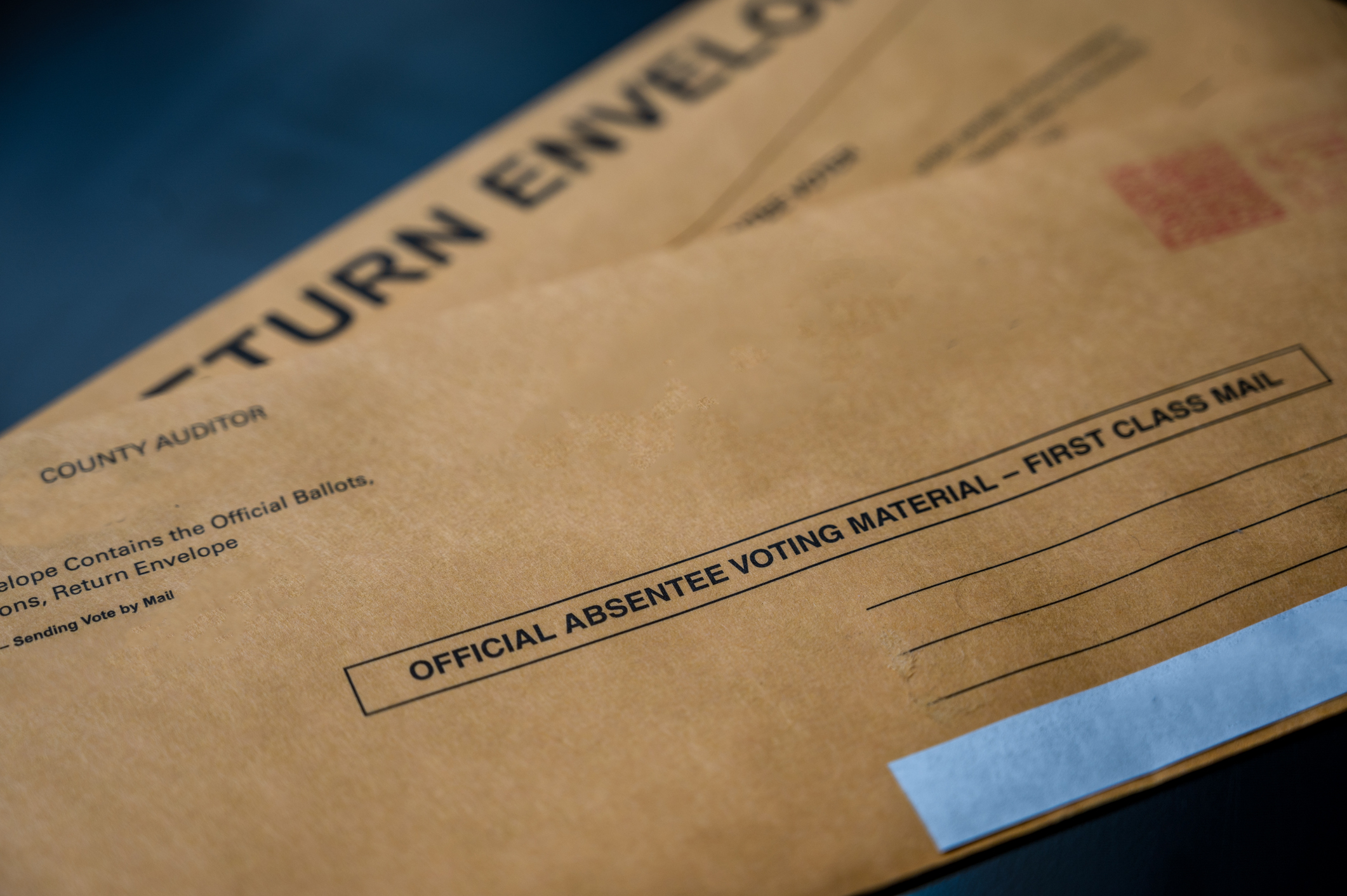 ballots in beige envelopes