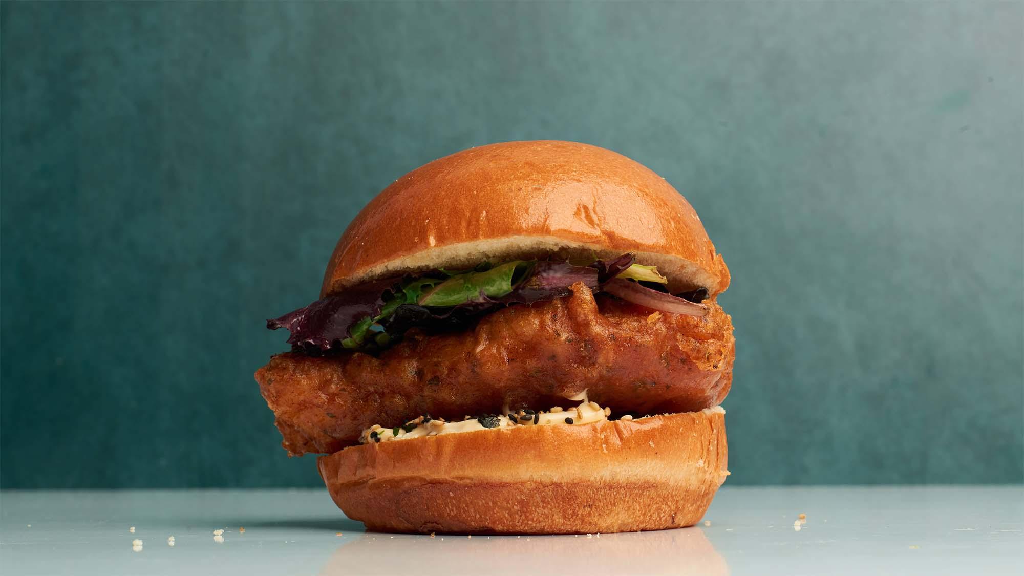Crispy fish sandwich on glossy brioche bun