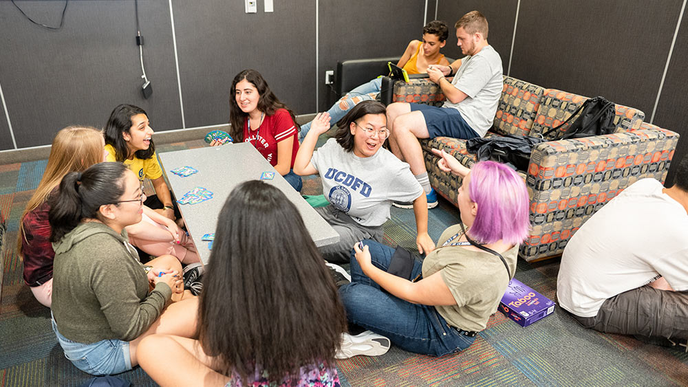 students play games in common room of dorm