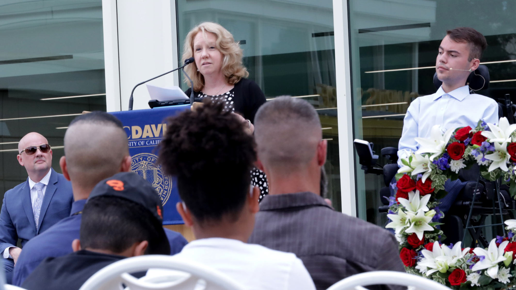 Woman speaks from UC Davis podium