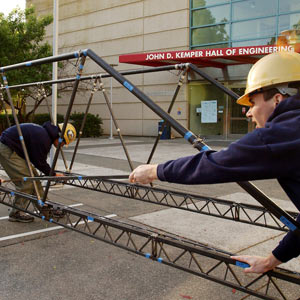 Engineering students working on a bridge project