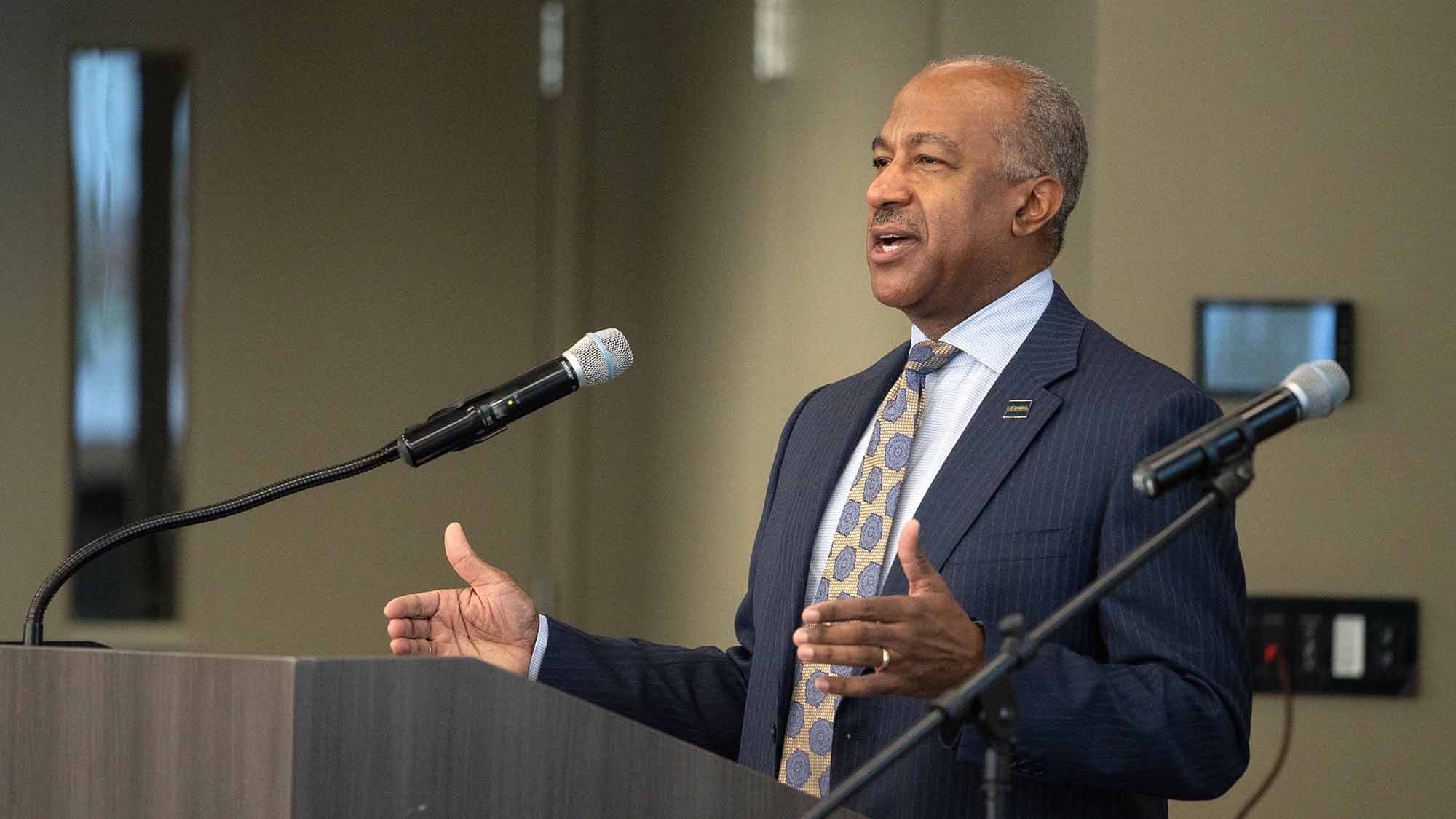 Chancellor Gary S. May gestures while speaking.