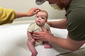 Young boy on doctor's exam table