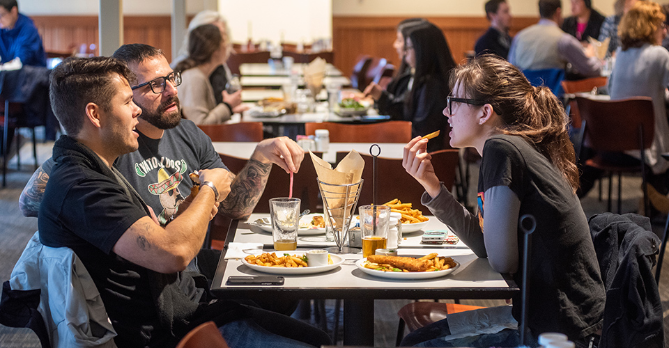 friends eat food at a uc davis restaurant