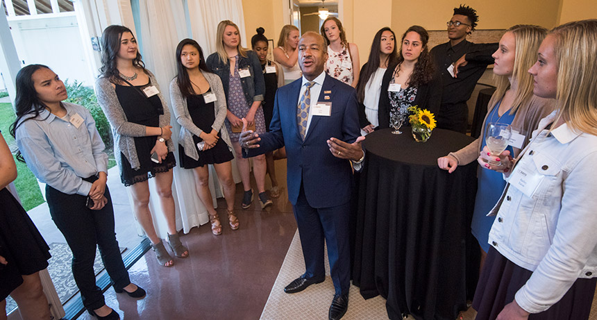 Gary May speaks to UC Davis basketball players.