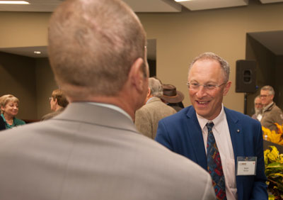 Ralph Hexter greets an audience member.