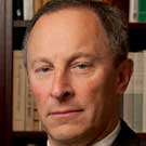 Interim Chancellor Ralph J. Hexter mugshot, books in background