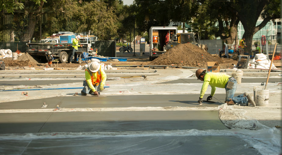 Concrete finishers at work in MU North Courtyard