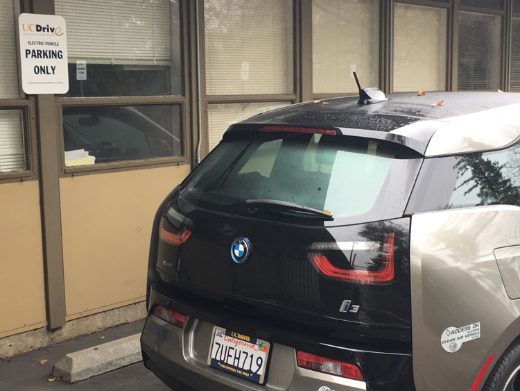 BMW ie3, brown, parked at Facilities Management.