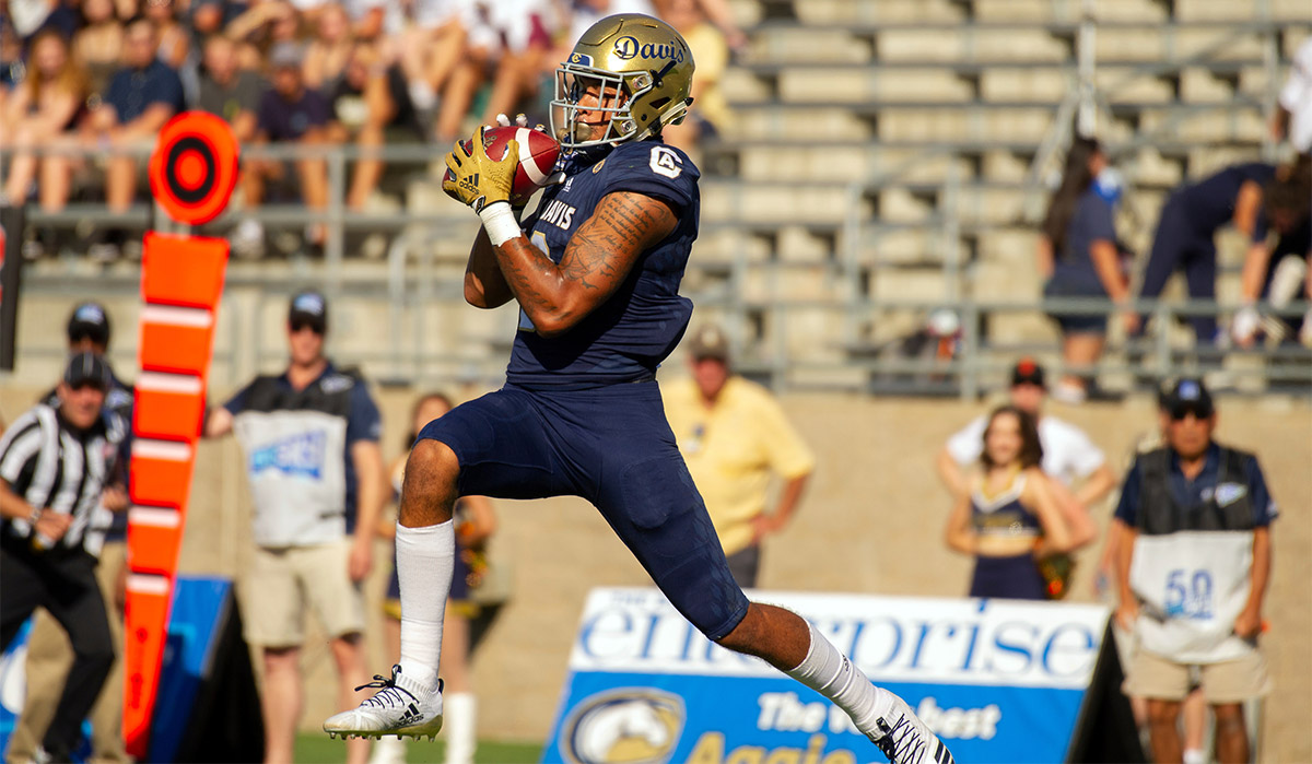 Keelan Doss catches a football.