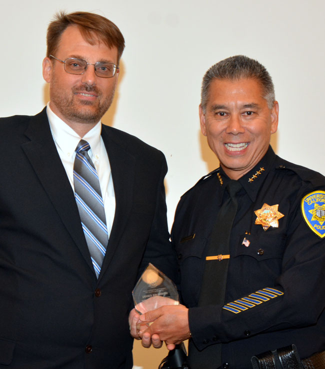 Police chief presents trophy.