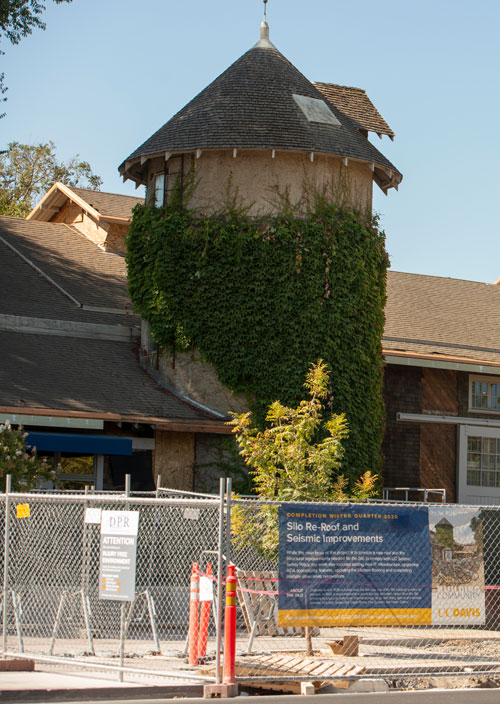 Silo behind construction fence