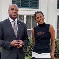 Chancellor Gary May and LeShelle standing in a front yard