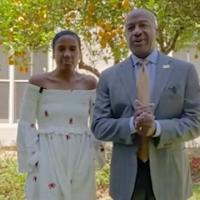 Chancellor Gary May and LeShelle in front of a fruit tree