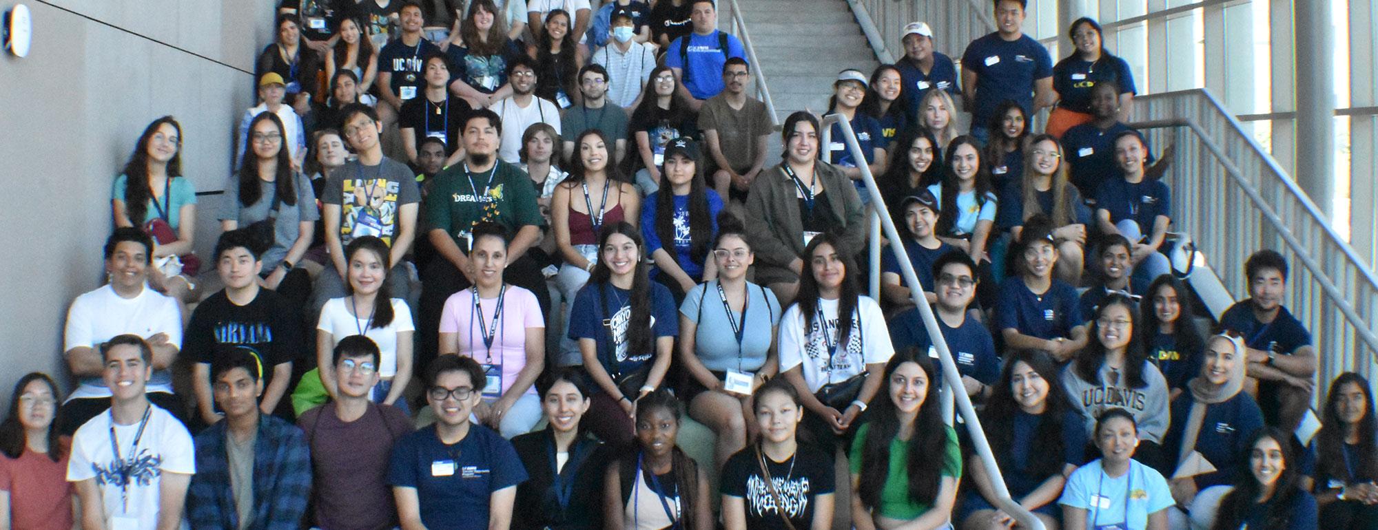 A group of students posing on the stairs