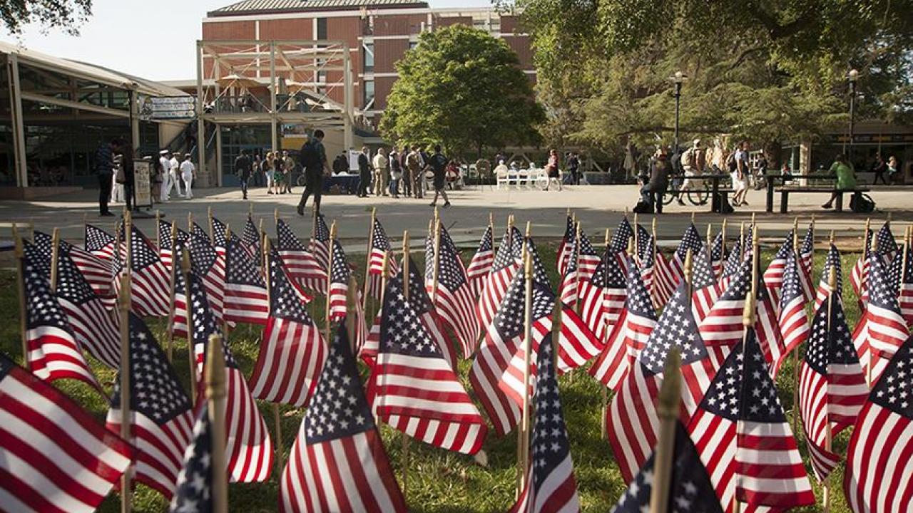 Photo: Flag display, on Quad, with Memorial Union in the background