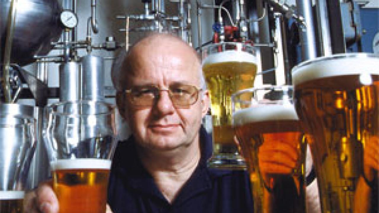 PHoto: Charles Bamforth holds mug of beer