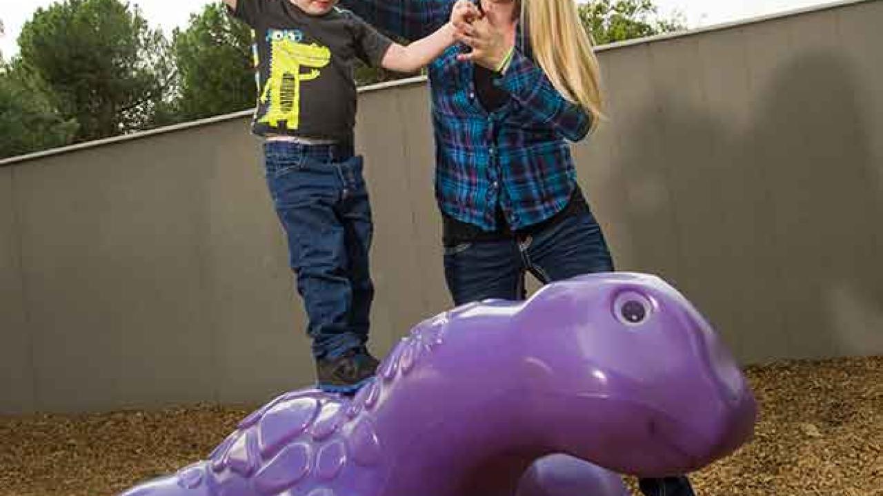 Photo: Amanda Sanderson and her son, Bradley, in a play yard