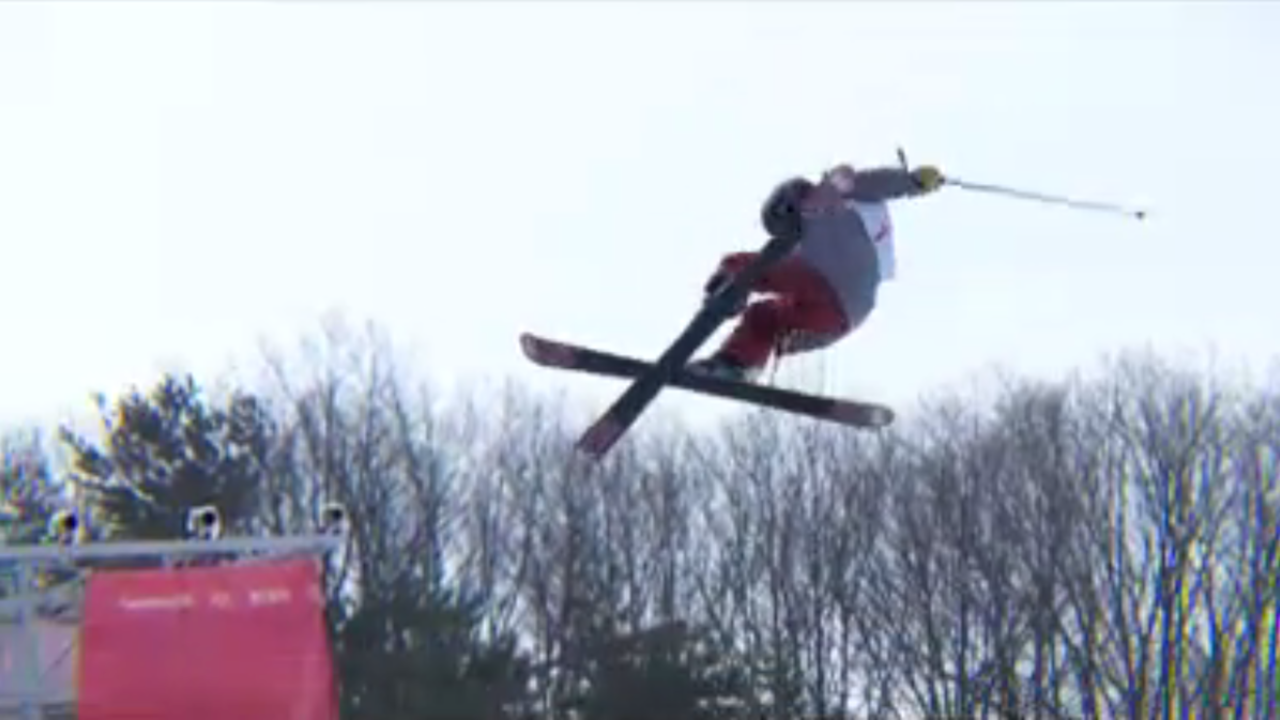 Screenshot of freeskier flying above halfpipe.