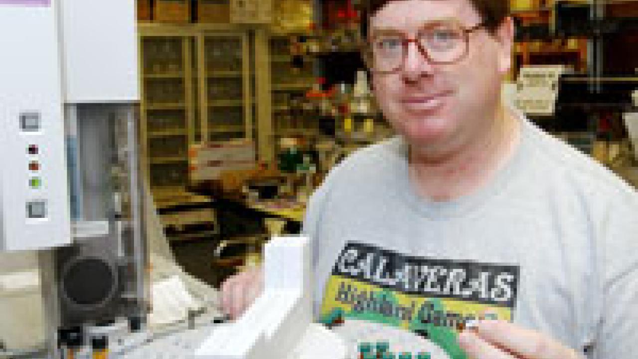 Jack Henderson works in his Meyer Hall lab, wearing a clue to his favorite pastime &Atilde;&#145; Scottish games. The Davis resident has a wife, Lisa, and a 5-year-old son, Robert.    