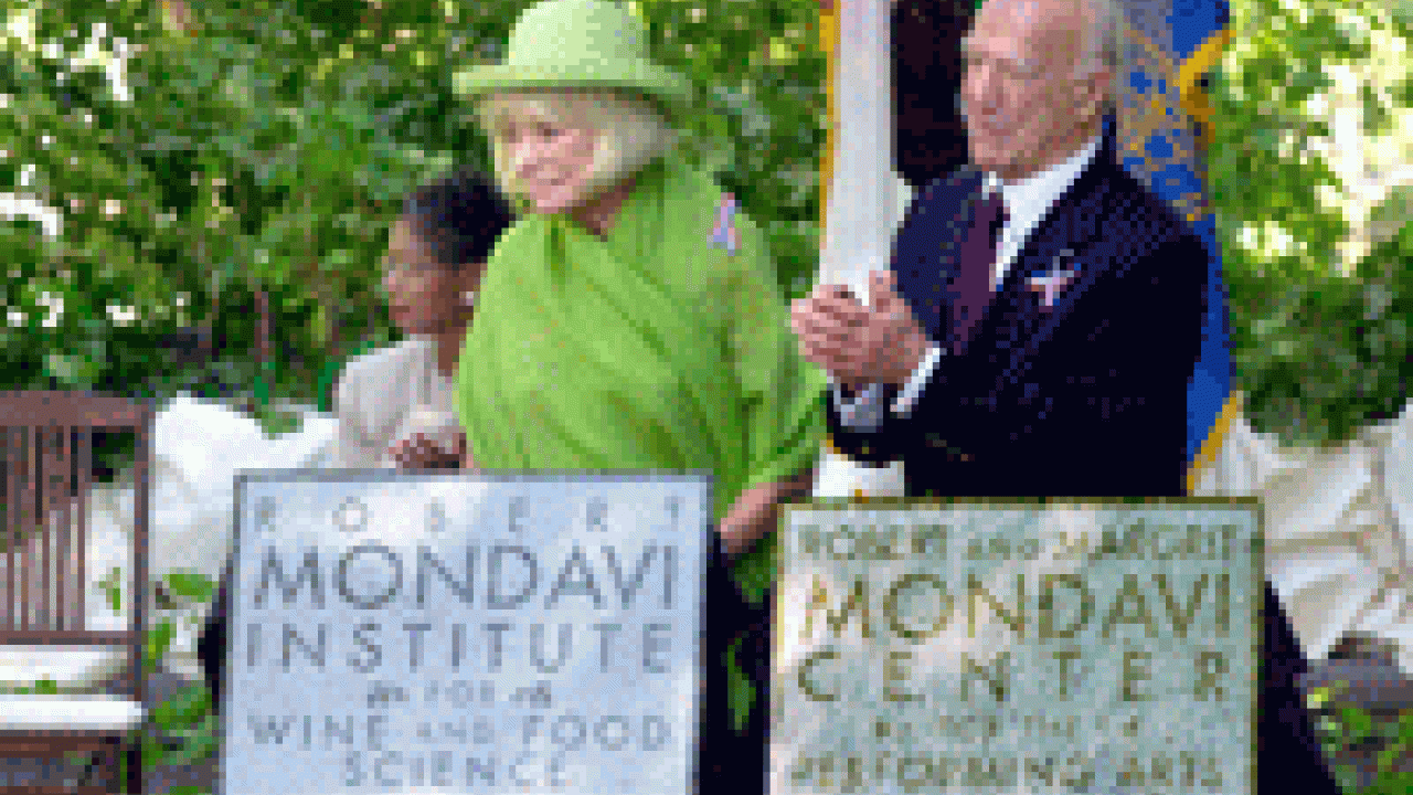 Margrit and Robert Mondavi display the name plaques for the Robert Mondavi Institute of Wine and Food Science, and the Robert and Margrit Mondavi Center for the Performing Arts.