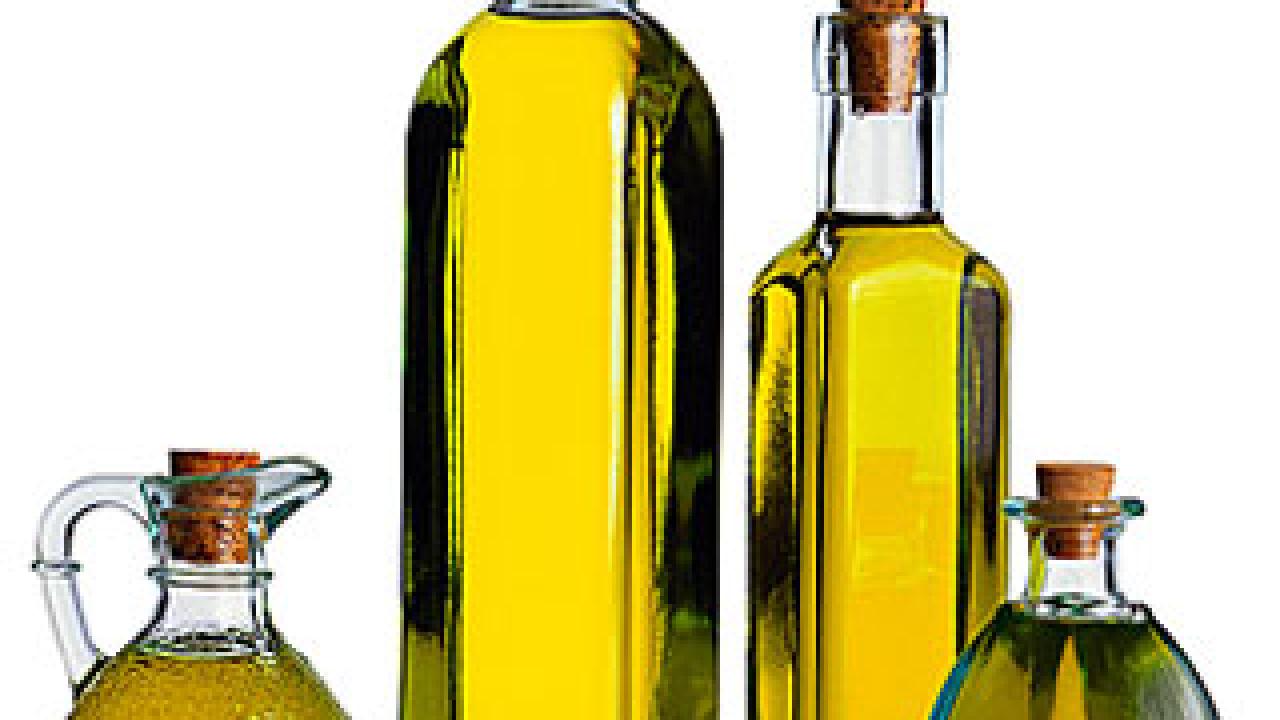 Photo: bottle and cruet of olive oil