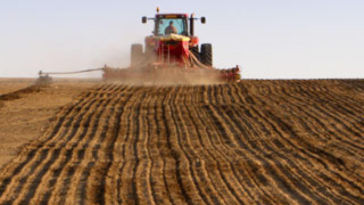 Machine discing soil
