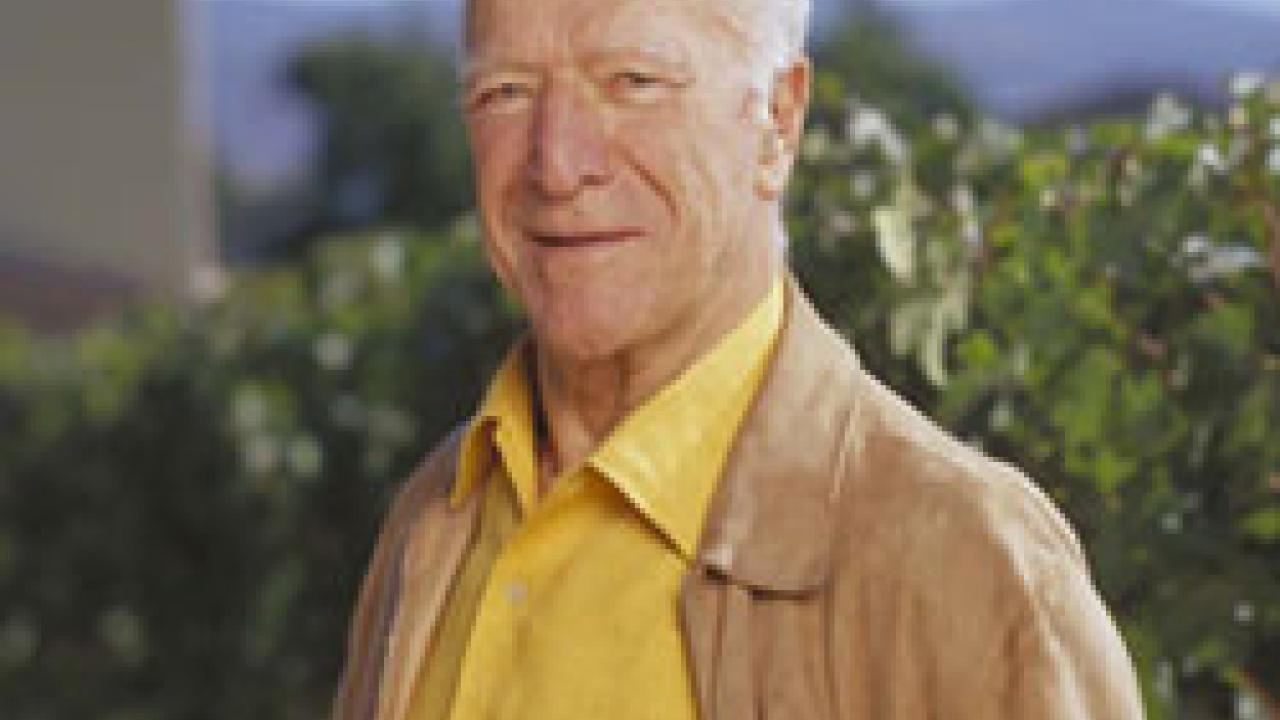 Photo: Robert Mondavi with vineyardin background