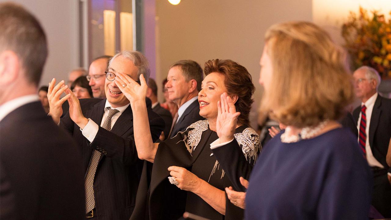 Maria Manetti Shrem waves during the Jan Shrem and Maria Manetti Shrem Museum of Art Legacy Dinner.