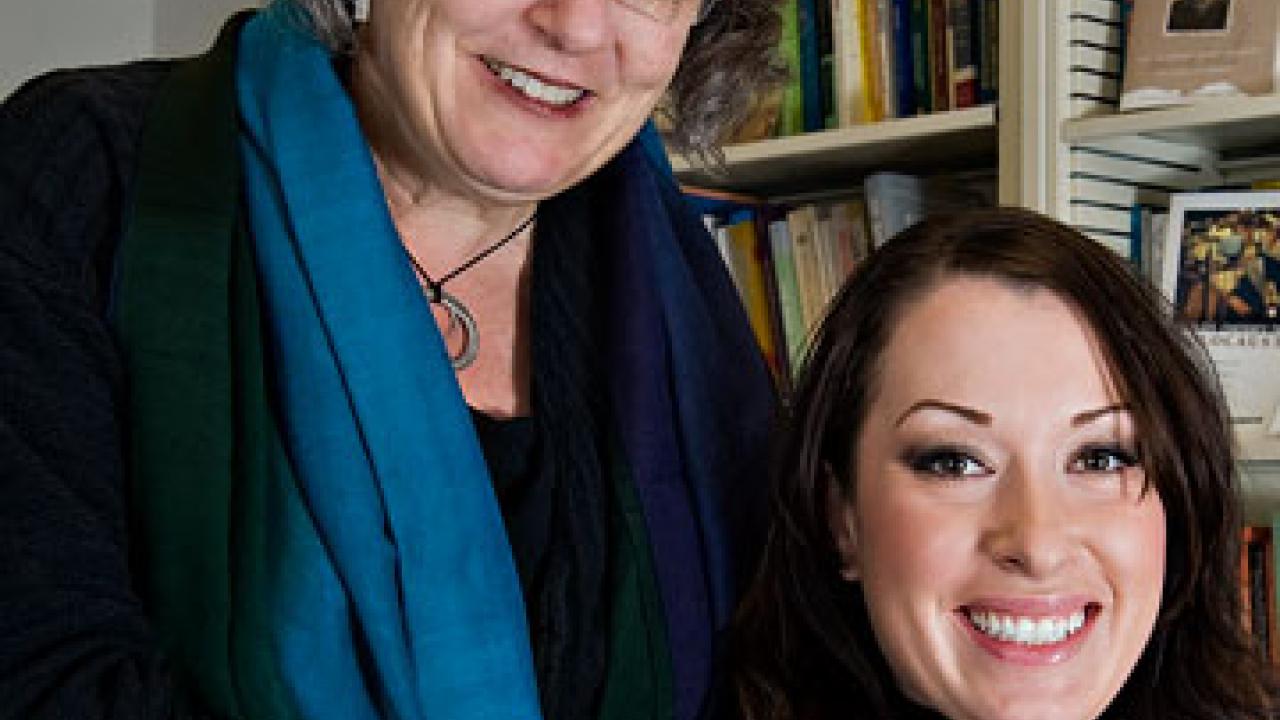 Photo: Diane Wolf, left, standing, with hand on Brandy Jenkins' shoulder.