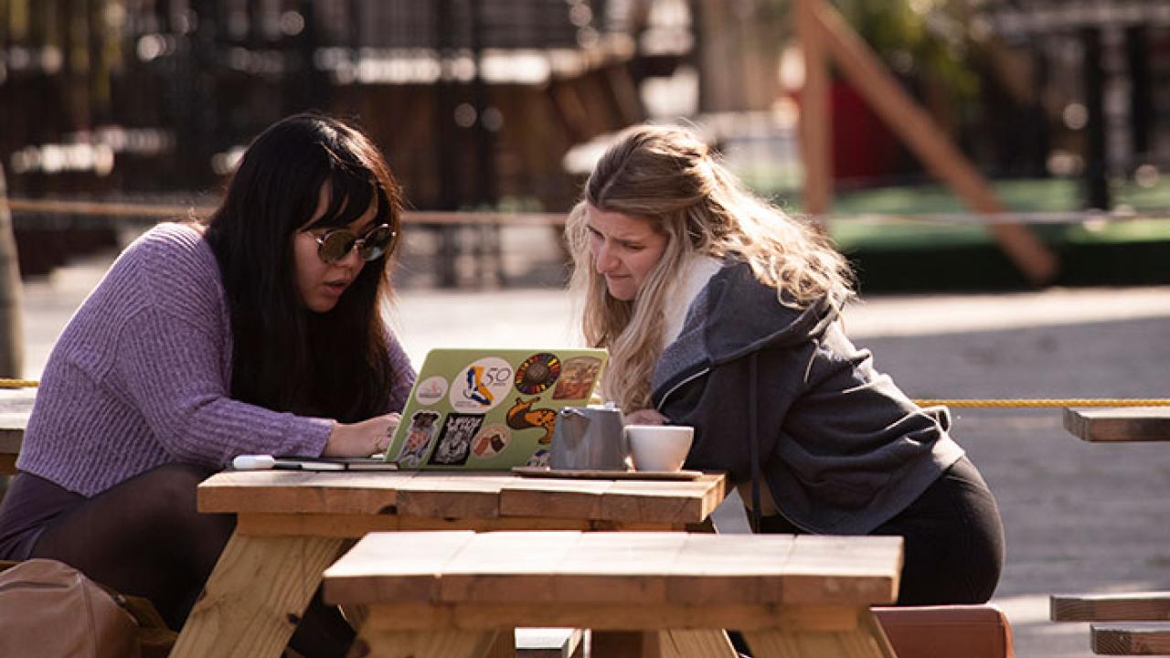 UC Davis students at an outdoor restaurant in town