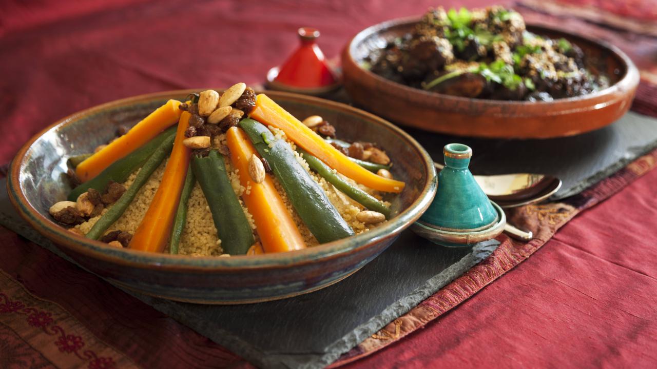 A colorful meal served in two clay pots in a traditional African fashion
