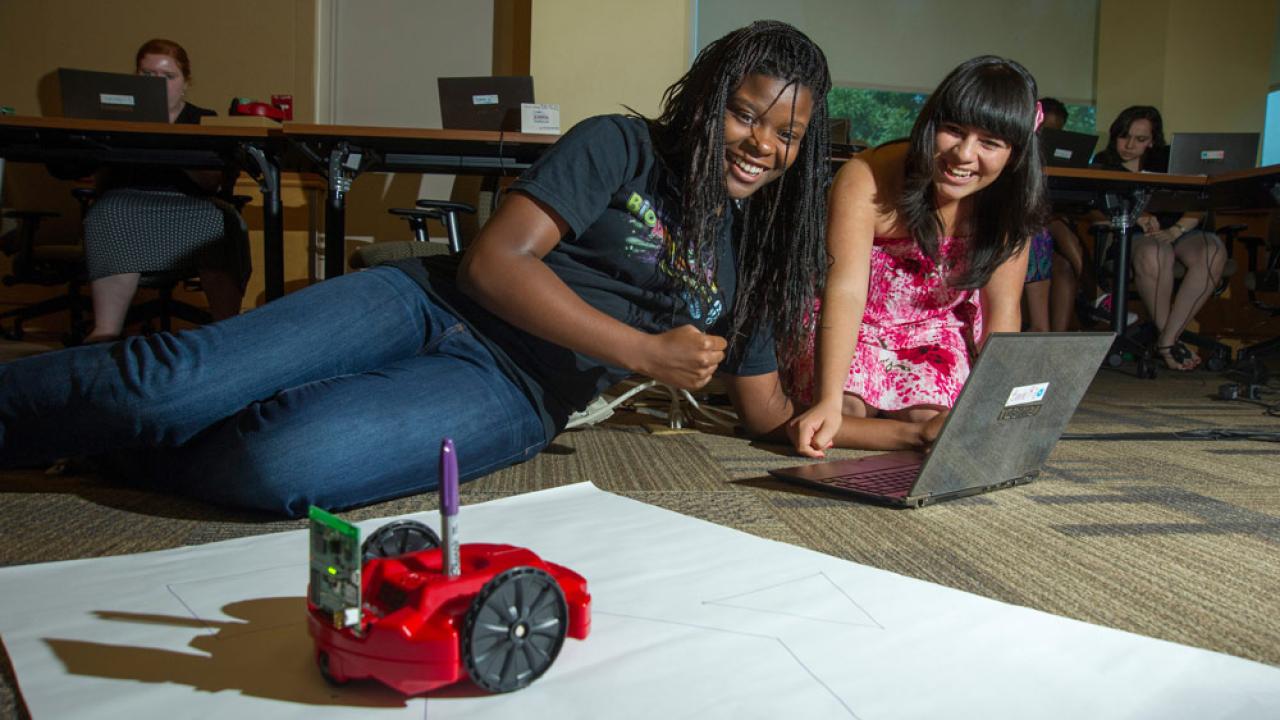 two students working on a project for class