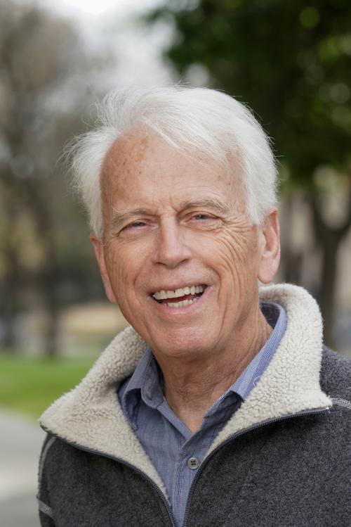 Headshot of older man with white hair