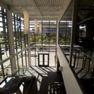 The foyer in the Graduate School of Managements Gallagher Hall features tall windows that maximize natural daylight and motion-sensitive lighting controls in every room. Overall, the building is 30 percent more efficient than a typical office b