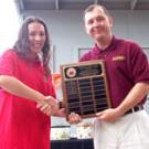 Elizabeth Guerra, representing the first-place anthropology department, poses with Lt. Col. Mark W. Connelly, chair of military science, after the May