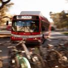 Unitrans bus, with parked bicycles in foreground