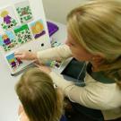 UC Davis psychologist Kristin Laguttuta interviews a 3-year-old for a study on anxiety in males and females.
